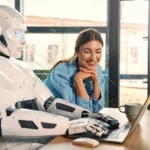 robot-and-woman-working-on-laptop-in-office